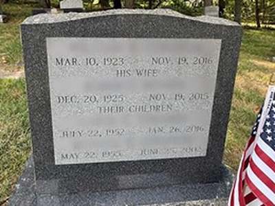 Family memorial headstone with engraved dates — after cleaning